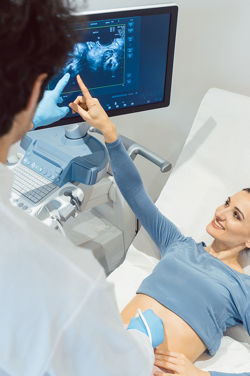 Doctor,Gynecologist,And,Woman,In,Ultrasonic,Pregnancy,Test,At,Fertility